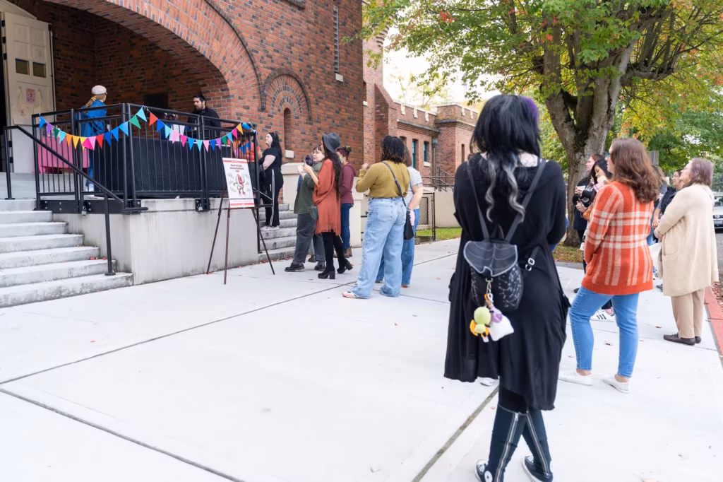 Community members gathered early to experience a grown-up take on the classic Scholastic Book Fair.
