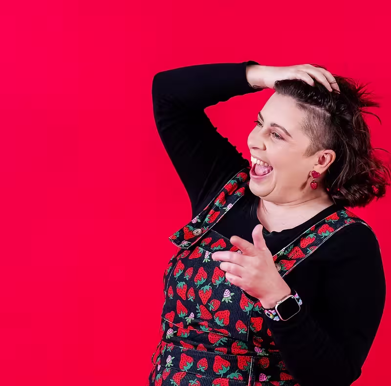 inclusive-event-planner-cute-story-events-brand-portrait Inclusive event planner Ryan Criswell laughing in a colorful brand portrait for Cute Story Events