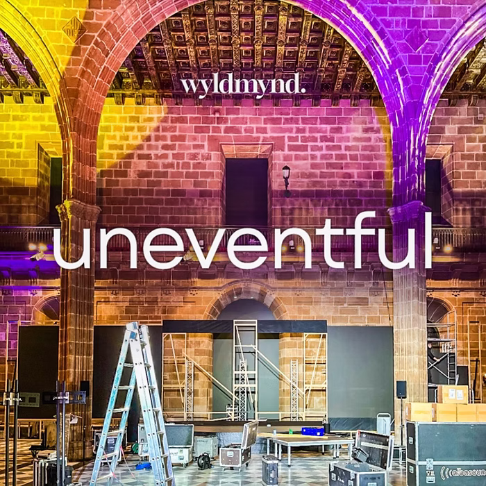Stage setup and podcast branding for the Uneventful podcast featuring an interview with the founder of Cute Story Events.