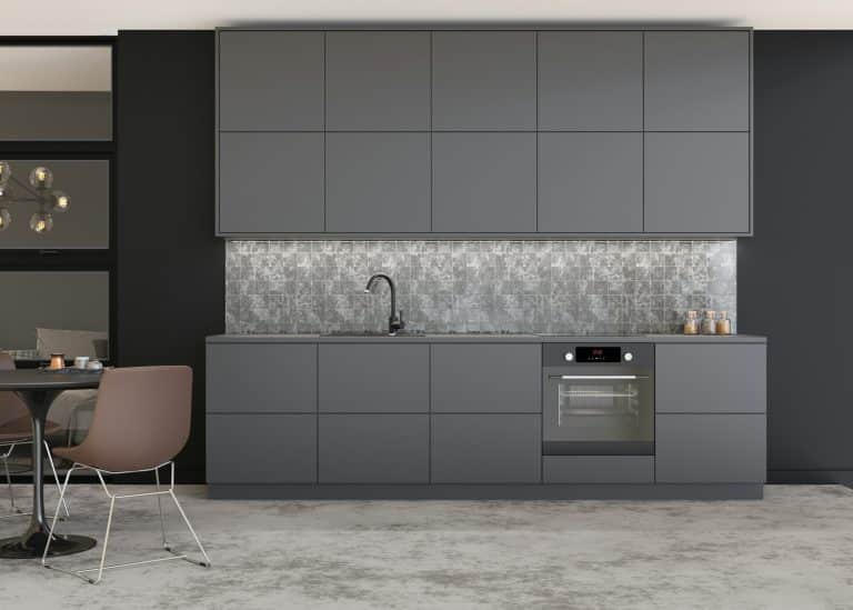 Beautiful and modern kitchen. Gray kitchen furniture. Home interior