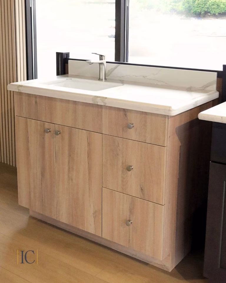 Example of kitchen remodeling: Woodgrain vanity cabinet with quartz countertop and sink from the Iconic Cabinetry showroom