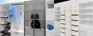 Winter White closet system with glass cabinet doors, black accent shelving, and soft-close drawers designed for shoes, clothing, and accessories