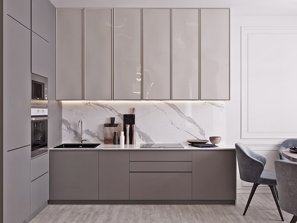 Minimalist gray slim shaker cabinets with glossy finishes and a marble backsplash in a modern kitchen design