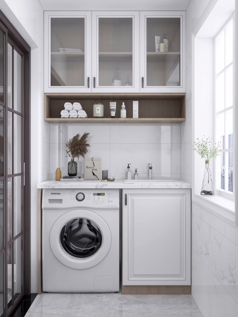 Efficient laundry room design with built-in storage cabinets, stacked washer-dryer, and modern lighting